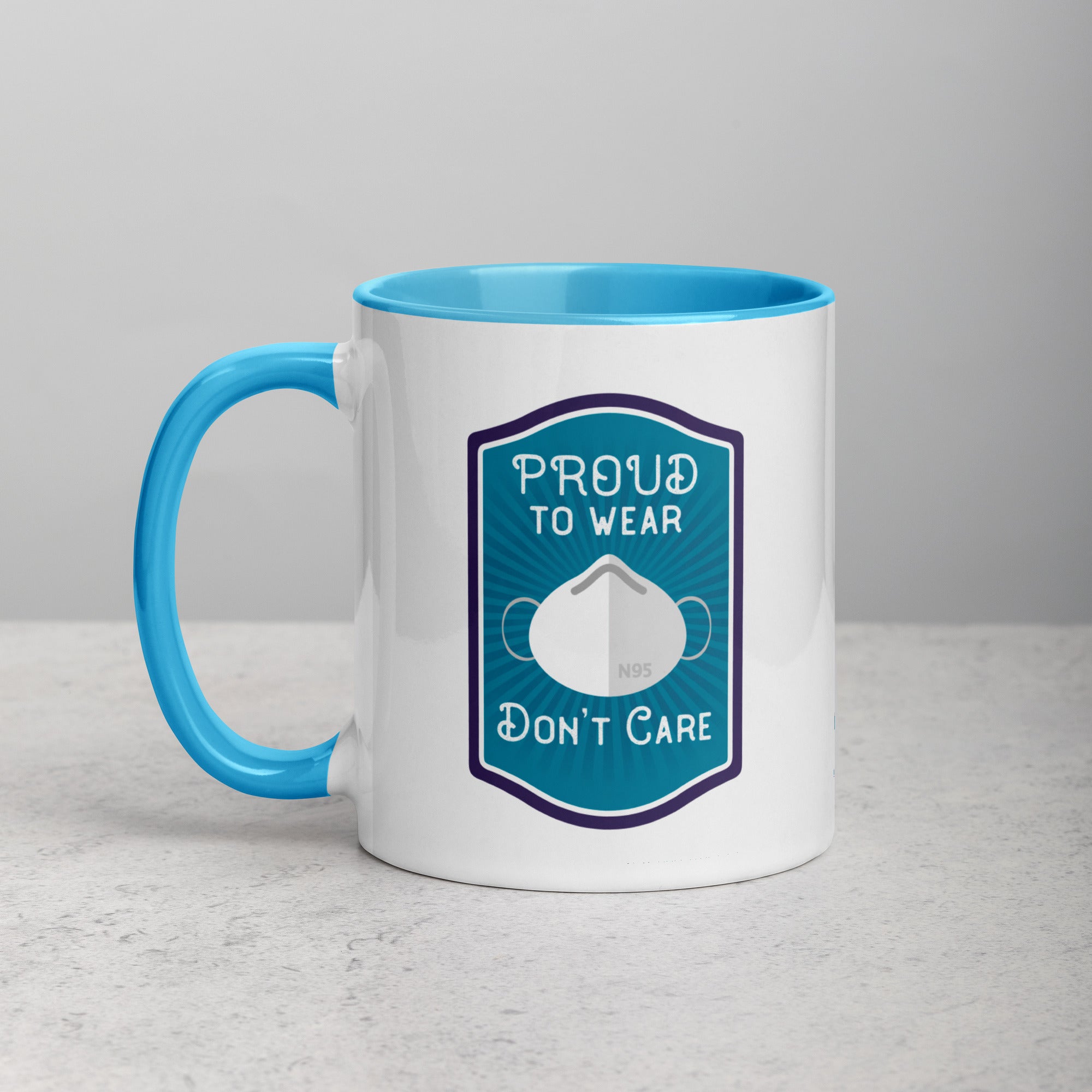 side view of Proud to wear, don't care mug with blue interior